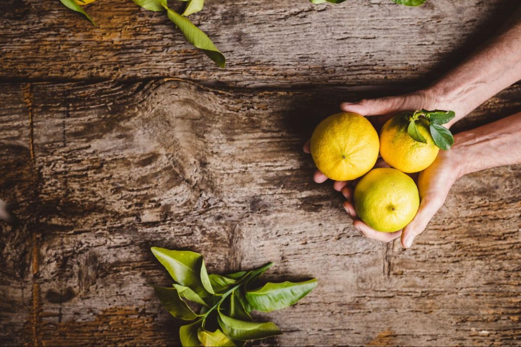 Bergamot Fruit of Calabria on a Wooden Table of a Farm in the countryside.